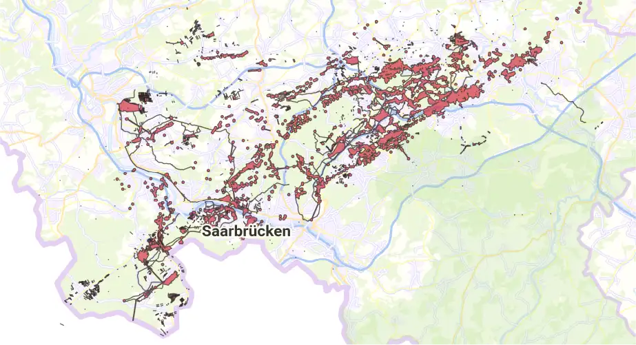 Karte des Saarlands mit rot markierten Bergbau-Bearbeitungsräumen der RAG im Umland von Saarbrücken.